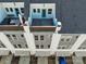 Aerial view of townhomes with private patios and driveways, highlighting the property's layout and design at 582 West End Dr, Charlotte, NC 28208