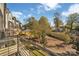 Balcony view of outdoor space with a gazebo, lawn, community, trees, and adjacent townhome buildings at 582 West End Dr, Charlotte, NC 28208