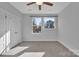 Cozy bedroom with two windows, soft carpet, and closet doors at 582 West End Dr, Charlotte, NC 28208
