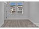 Bedroom showcasing neutral walls and carpet, with a large window offering natural light at 582 West End Dr, Charlotte, NC 28208