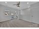 Bedroom with door to outside, neutral carpet, and a ceiling fan providing comfort at 582 West End Dr, Charlotte, NC 28208