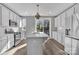 Bright kitchen with island, stainless steel appliances, and hardwood flooring at 582 West End Dr, Charlotte, NC 28208