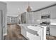 Open kitchen with center island that connects to the living room at 582 West End Dr, Charlotte, NC 28208