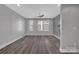 Bright living room with hardwood flooring and a modern ceiling fan at 582 West End Dr, Charlotte, NC 28208