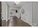 Home entryway with double doors, stone flooring, and views into the living areas at 6641 Melody Ln, Charlotte, NC 28215