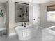 Modern bathroom with standalone tub, glass shower, and neutral tones at Lot 42 Watercourse Way # Hawthorne, Belmont, NC 28012