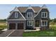 Attractive two-story home featuring a stone facade, grey siding, and an attached two-car garage at Lot 42 Watercourse Way # Hawthorne, Belmont, NC 28012