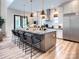 Modern kitchen with gray island, stainless steel appliances, and hardwood floors at Lot 51 Watercourse Way # Nottingham, Belmont, NC 28012