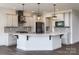 Modern kitchen with white and gray cabinets, large island, and quartz countertops at Lot 51 Watercourse Way # Nottingham, Belmont, NC 28012