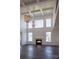 Open living room with high ceilings, hardwood floors, and fireplace at Lot 51 Watercourse Way # Nottingham, Belmont, NC 28012