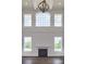 Bright living room featuring a fireplace and expansive windows at Lot 51 Watercourse Way # Nottingham, Belmont, NC 28012