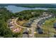 Aerial view of new homes being built in a lakeside community with lake views and lush green trees at Lot 51 Watercourse Way # Arcadia, Belmont, NC 28012