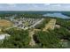 Aerial view of a beautiful community near a lake with lush green trees surrounding the homes at Lot 51 Watercourse Way # Arcadia, Belmont, NC 28012