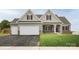 Beautiful home boasting a three-car garage, a cozy porch, and stone detailing at Lot 51 Watercourse Way # Arcadia, Belmont, NC 28012