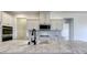Modern kitchen showcasing white cabinets, a marble countertop, and sleek hardware at Lot 51 Watercourse Way # Arcadia, Belmont, NC 28012
