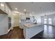 Bright kitchen featuring white cabinetry, a center island, and stainless steel appliances at Lot 51 Watercourse Way # Arcadia, Belmont, NC 28012