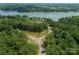 Aerial view of the intersection of neighborhood streets near a lush green waterfront community at Lot 51 Watercourse Way # Covington, Belmont, NC 28012