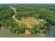 Gorgeous aerial view of a waterfront property surrounded by mature trees, with lake views at Lot 51 Watercourse Way # Covington, Belmont, NC 28012
