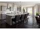 Modern kitchen with a center island, seating, ample cabinet space, and stainless steel appliances at Lot 51 Watercourse Way # Covington, Belmont, NC 28012
