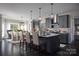 Kitchen with a center island and seating, stainless steel appliances, and an adjacent dining area at Lot 51 Watercourse Way # Covington, Belmont, NC 28012