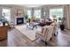 Bright living room with hardwood floors, fireplace, and plenty of natural light at Lot 51 Watercourse Way # Covington, Belmont, NC 28012