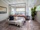Bedroom with a decorative metal canopy bed, natural light, and a cozy seating area at Lot 51 Watercourse Way # Covington, Belmont, NC 28012