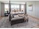 Inviting main bedroom featuring neutral tones, a decorative bed, and a cozy seating area at Lot 51 Watercourse Way # Covington, Belmont, NC 28012