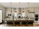 Spacious kitchen with white cabinets, stainless steel appliances, large island, and modern pendant lighting at Lot 51 Watercourse Way # Nottingham, Belmont, NC 28012