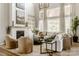 Elegant living room featuring a cozy fireplace, large windows, hardwood floors, and stylish decor at Lot 51 Watercourse Way # Nottingham, Belmont, NC 28012