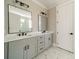Bathroom featuring double vanity sinks, black fixtures, and a modern aesthetic at 149 Pinewood St, Troutman, NC 28166