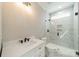 Bathroom featuring marble walk-in shower and a white, modern vanity at 149 Pinewood St, Troutman, NC 28166