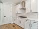 Close-up of white kitchen cabinets, countertop, and gas cooktop at 149 Pinewood St, Troutman, NC 28166