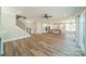 Open living space with stairs, hardwood floors, and view of the kitchen at 149 Pinewood St, Troutman, NC 28166
