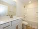 Well-lit bathroom showcasing a vanity, toilet, tub, and shower combo, providing convenience and comfort at 157 Halite Ln, Waxhaw, NC 28173