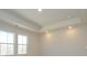 Bedroom featuring tray ceiling, recessed lights and large windows for natural lighting at 157 Halite Ln, Waxhaw, NC 28173