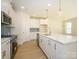 Well-equipped kitchen featuring stainless appliances, a center island, and ample counter space at 157 Halite Ln, Waxhaw, NC 28173