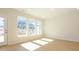 Bright, airy living room with large windows, hardwood floors, and recessed lighting at 157 Halite Ln, Waxhaw, NC 28173