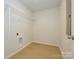 Spacious utility closet with wooden floor, white walls and wire shelving for convenient storage at 157 Halite Ln, Waxhaw, NC 28173