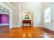 Bright foyer featuring hardwood floors, a console table, and a colorful rug at 2031 Sandy Pond Ln, Waxhaw, NC 28173