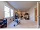 Spacious carpeted home gym with lots of natural light and exercise equipment at 2031 Sandy Pond Ln, Waxhaw, NC 28173