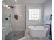 Modern bathroom with walk-in shower and soaking tub at 2335 Emanuel Church Rd, Rockwell, NC 28138