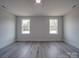 Spacious bedroom with two windows and vinyl plank flooring at 2335 Emanuel Church Rd, Rockwell, NC 28138