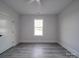Simple bedroom with large window and ceiling fan at 2335 Emanuel Church Rd, Rockwell, NC 28138