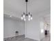 Spacious dining room with a modern chandelier and luxury vinyl plank flooring at 2335 Emanuel Church Rd, Rockwell, NC 28138