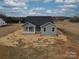 Gray house with a covered porch and backyard at 2335 Emanuel Church Rd, Rockwell, NC 28138