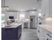 Modern kitchen with white cabinets, stainless steel appliances, and a large island at 2335 Emanuel Church Rd, Rockwell, NC 28138
