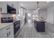 Modern kitchen with stainless steel appliances and large island at 2335 Emanuel Church Rd, Rockwell, NC 28138