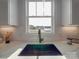 Modern kitchen sink with a black undermount sink and a gold faucet at 2335 Emanuel Church Rd, Rockwell, NC 28138