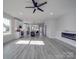 Open living room with fireplace and vinyl plank flooring at 2335 Emanuel Church Rd, Rockwell, NC 28138