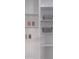 White pantry with ample shelving for storage at 2335 Emanuel Church Rd, Rockwell, NC 28138
